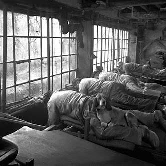 (workshop room scenes in Thiers factories) — gives context of space and setup. Many workers